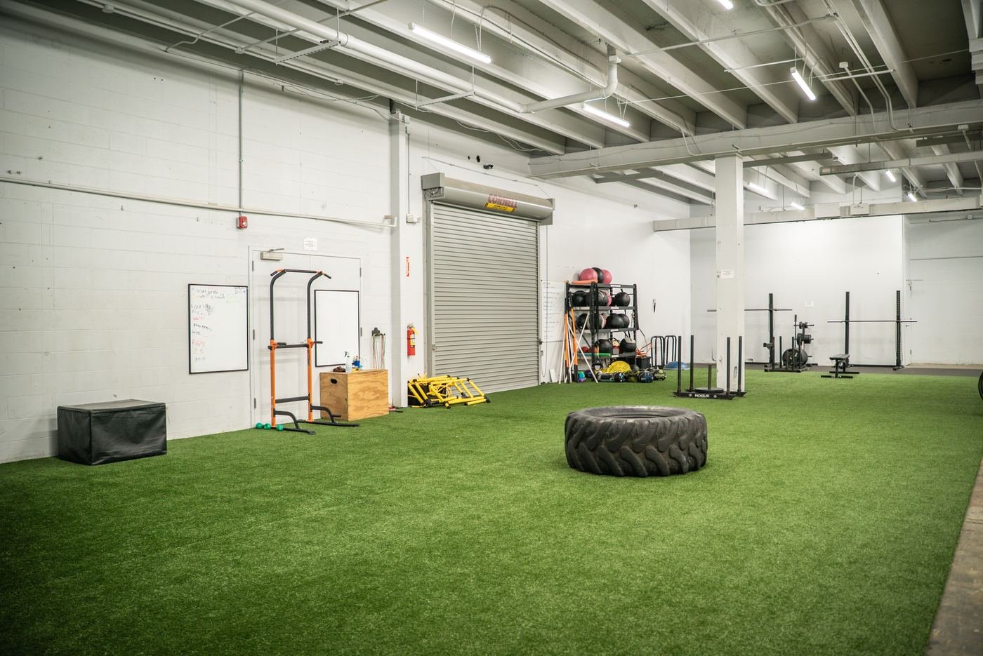 Turf lane with tire, sleds and squat racks