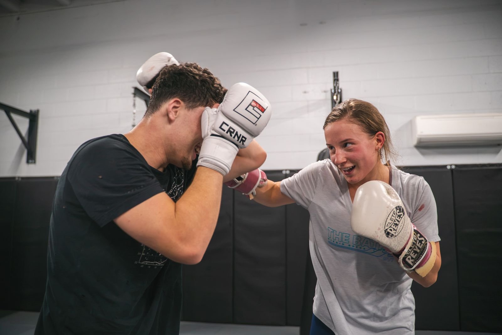 Two members sparring in a boxing class at Nashville MMA Training Camp