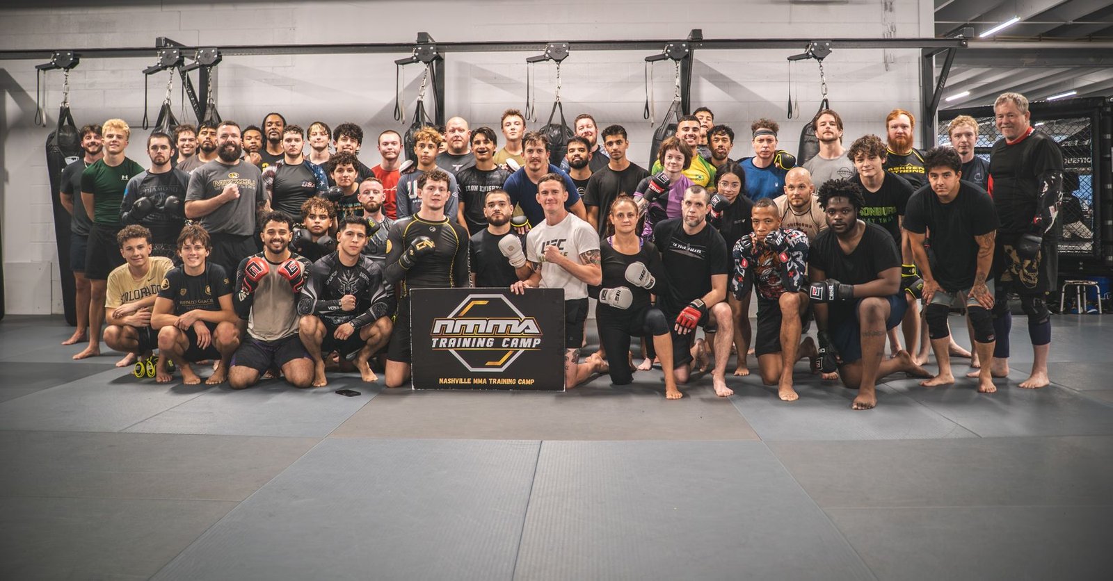 Nashville MMA Training Camp members and coaches in a group photo on the mats